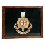 A WW1 Royal Sussex Regiment embroidered badge, framed and glazed. Overall size 53.5cms (21ins) by