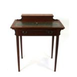 A late 19th century mahogany writing table with rectangular top and inset leather, above a single