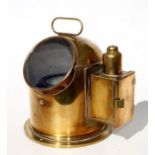 A brass binnacle compass with side compartment oil lamp burner. Compass is marked A.T. Chamberlain &