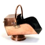 A Victorian copper coal scuttle.