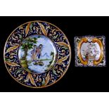 A continental maiolica style charger decorated with a young couple within a foliate border, 37cms (