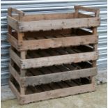 A group of five wooden apple crates.