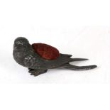 A Victorian pewter pin cushion modelled a a swallow, 10cms (4ins) long.