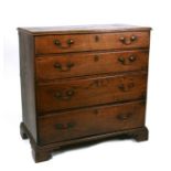 An early 19th century oak chest of four long graduated drawers, on bracket feet, 97cms (38ins)