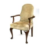 A mahogany elbow chair with upholstered seat and back, on cabriole front supports.