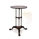 A 19th century mahogany wig stand converted an occasional table.