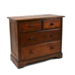 An oak chest with two short and two long graduated drawers, on a plinth base, 92cms (36ins) wide.