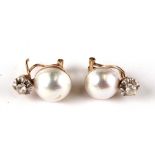 A pair of pearl cabochon yellow metal mounted (tests as 18ct) earrings.Condition Report Small area