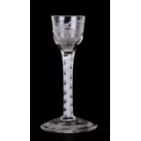 An 18th / 19th century air twist stem wine glass with etched bowl, 14cms (5.5ins) high.Condition