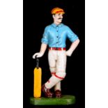 A cast iron door stop in the form of a cricketer, 33cms (13ins) high.