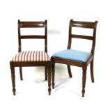 A pair of 19th century mahogany chairs with drop-in upholstered seats, on turned front supports.