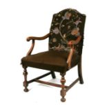 A 19th century walnut elbow chair with upholstered seat and back, on turned front supports.Condition