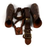 A leather Sam Browne belt and gaiters.