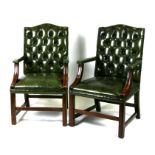 A pair of green leather button backed Georgian style office desk chairs.Condition Report Minor