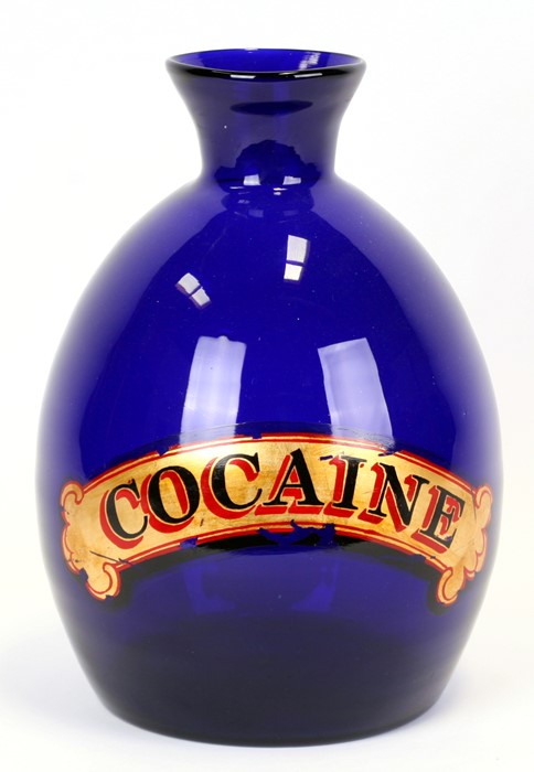 A large cobalt blue vase with gilt lettering 'Cocaine', 31cms (12ins) high.