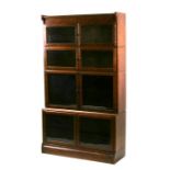 A 'Minty' 1920's oak four piece Globe Wernicke style sectional bookcase, each section fitted with