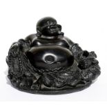 A resin figure of a seated Buddha. 9cm (3.5 ins) high