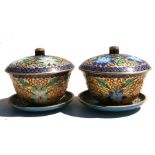 A pair of Chinese gilt metal and enamel bowls, cover and stands, 13cm (5ins) diameter.