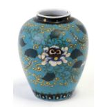 A Japanese porcelain cloisonne style vase decorated with flowers on a turquoise ground, seven
