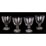 A set of four 19th century etched glass rummers with lemon squeezer base, 13cms (5ins) high) (4).