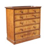 A late 19th century Howard & Sons oak chest with two short and four long graduated drawers, on a