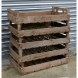 A group of five wooden apple crates.