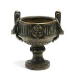 A 19th century Grand Tour bronze two handled vase. 13cm (5 ins) high