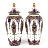 A pair of Royal Worcester vases and covers, pattern 2470, 24cms (9.5ins) high.Condition Report