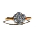 An 18ct gold diamond cluster ring, approx UK size 'J'.