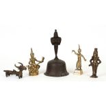 A group of brass temple figures; together with a Tibetan hand bell (5).