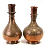 Two Indian copper vases, 34cms (13.25ins) high.