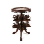 A Chinese hardwood library table, the circular top inset with figured marble with revolving two-tier