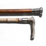 A Malacca walking stick with Chinese white metal handle; together with a bamboo walking stick with