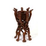 An African carved hardwood jardiniere on stand, 52cms (20.5ins) high.