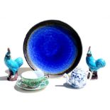 A Japanese blue glaze plate, 28cm (11ins) diameter; together with a blue & white miniature tea