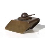 A WW1 brass trench art Tank with revolving turret guns. Overall length 14cms (5.5ins)