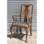 A late 19th / early 20th century oak carver chair with drop-in seat, on cabriole front supports.