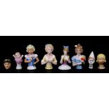 A group of pin cushion dolls and cake toppers, the largest 7cms (2.75ins) high.