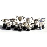 A group of small silver plated trophies