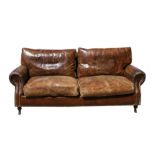 A modern distressed brown leather three seater sofa. 181cm (71.25 ins) wideCondition Report Depth