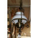 An Arts & Crafts wrought iron and brass hanging oil lamp and shade (converted to electricity).