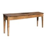 A stripped pine triple school desk on square tapering legs, 213cms (84ins) long.Condition Report