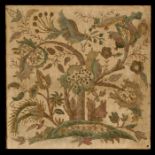 A crewel work style panel depicting birds amongst foliage, 52 by 52cms (20.5 by 20.5ins).