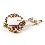 A 9ct gold ruby and diamond brooch.