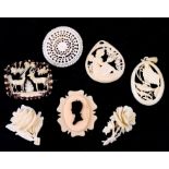 A group of late 19th / early 20th century ivory, bone and ivorine brooches and pendants.