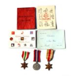 A WW2 medal trio including the Africa and Italy Stars, together with Pay Book and Xmas cards