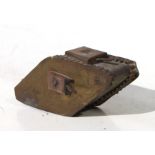 A WW1 brass and copper trench art Tank with turret cannon and machine guns, engraved into the