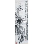 A Chinese scroll painting depicting bamboo and calligraphy and seal marks, 36 by 127cm (14 by