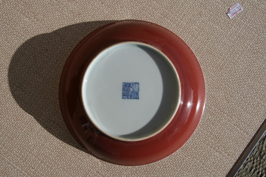 A Chinese red monochrome glaze shallow dish with blue seal mark to the underside, 19cms (7.5ins) - Image 5 of 14