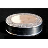 A Sterling silver pill box with enamelled picture depicting a reclining nude to the interior, 5cm (